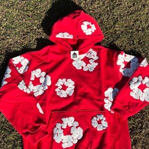 Denim Tear Red Hoodie with White Floral Design